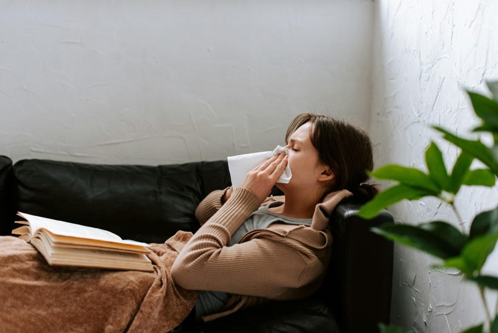 lady with cold - cold and flu symptoms and seeing a doctor