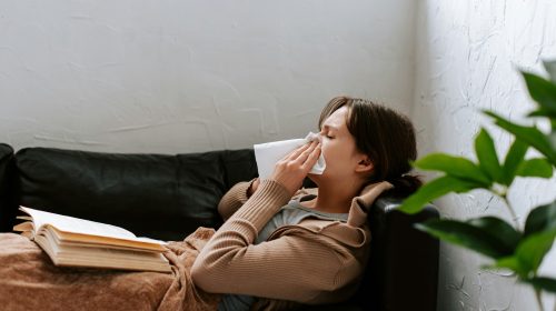 lady with cold - cold and flu symptoms and seeing a doctor